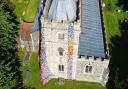 A drone shot of the amazing Barley Flower Tower at St Margaret of Antioch Church.