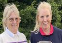 Gay Rodham and Debby Tweddle with their winners\' trophies at Heydon Grange Golf Club.