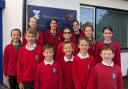 Headteacher Laura Penrose and deputy head Lynsey Perkins with Petersfield pupils