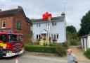 Royston firefighters retrieve the umbrella from the pub roof