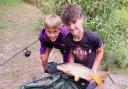 Children with their freshly caught fish in Melbourn