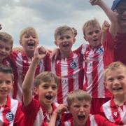 Morden Magpies U9s celebrate their victory at the Cambridge United Abbey Cup.