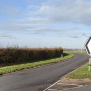 A crash on the A1198 saw a woman rushed to hospital with 