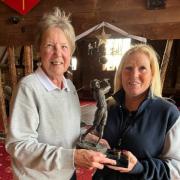 Lady captain Debs Tweddle (right) presents the If Only Trophy to Marilyn Symonds.