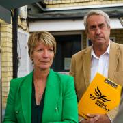 Pippa Heylings and South Cambs district councillor Brian Milnes talking to concerned residents at Shelford station