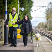 Mobile assistance team member Keith Williamson with Diane Rose and her dog Zen