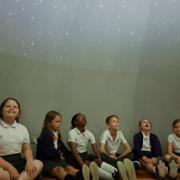 Children enjoying the planetarium at Roman Way Academy