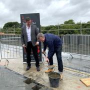 Artem Korolev and Richard Warwick take part in the topping out ceremony