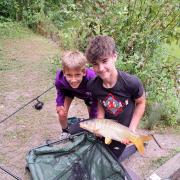 Children with their freshly caught fish in Melbourn