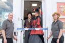 Kim Wilde (middle right) and Tony Lutkin (middle left) cutting the ribbon with store manager Nick Chalkley (far left) ands store owner Josie Chamberlin (far right).