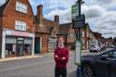 Hitchin MP Alistair Strathern at a bus stop in Shefford.