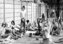 The early morning sun shines down on these tennis fans at Wimbledon. Many fans had camped out all night in the hope of getting tickets for the Men's singles final between Ilie Nastase and Bjorn Born. Date: July 3, 1976.