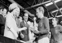 Queen Elizabeth II hands over the Jules Rimet Trophy to England captain Bobby Moore in 1966.