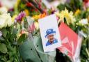 Flowers are laid outside of Windsor Castle following the death of Queen Elizabeth II