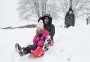 Jane Gill sledging with her four-year-old granddaughter Rosie in Hertfordshire, 2017.