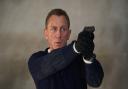 007 James Bond (Daniel Craig) prepares to shoot in No Time To Die, a DANJAQ and Metro Goldwyn Mayer Pictures film.