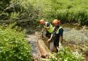 Council operatives Lee Haywood and Wes Thurley helping to restore the River Mel