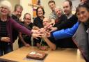 Royston Repair Café repairers cutting the cake to celebrate their 10th anniversary