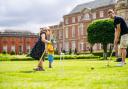 Children playing croquet on the lawn at Wimpole Estate