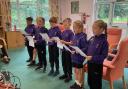 Therfield pupils singing at the Age UK club