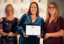 Anne-Marie Pratt, baby lead at Happy Bunnies (centre), with deputy manager Becs Angel (right) and the award presenter.