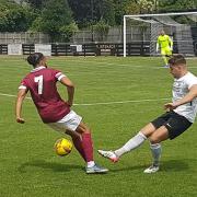 New Royston signing Jay Rolfe battles with Quentin Monville of Potters Bar Town.