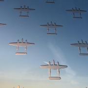 Counting the Cost memorial sculpture by Renato Niemis at IWM Duxford outside the American Air Museum. The sculpture comprises 52 panels engraved with the outlines of 7,031 aircraft, one for each plane missing in action in operations flown by American air