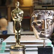 Make-up artist Mark Coulier's Oscar, which he won for 'The Iron Lady', and the BAFTA he won for 'The Grand Budapest Hotel'