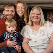 Alex and Claire Martin and their son Robin in Cambridgeshire with Louise Brown (right), the world's first 