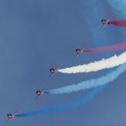 The Red Arrows display team and their iconic colourful vapour trail at a previous Duxford Summer Air Show.