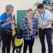 Evie Evans learnt to walk again with the help of labradoodle Poppy