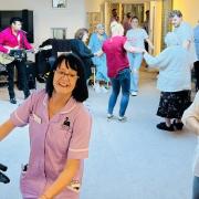 Residents and staff enjoying rock and roll at Southwell Court Care Home