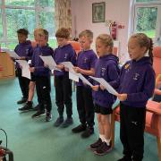 Therfield pupils singing at the Age UK club