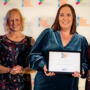 Anne-Marie Pratt, baby lead at Happy Bunnies (centre), with deputy manager Becs Angel (right) and the award presenter.