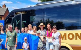 Royston Ukrainians gather outside the coach taking them to the Ukrainian Cultural Centre in Cheshunt