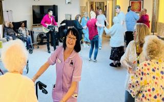 Residents and staff enjoying rock and roll at Southwell Court Care Home