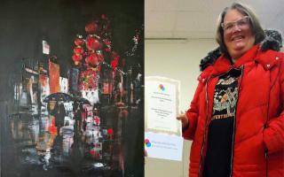 Jo Brown with her winning painting 'Red Lanterns'