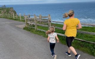 Emma Tooley running with her daughter